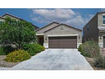 Charming single-story home with a desert landscaped front yard and a two-car garage at 4774 E Chromium Rd, San Tan Valley, AZ 85143