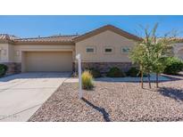 Charming single-story home with a well-maintained desert landscape and a neutral-toned exterior at 1539 E Brenda Dr, Casa Grande, AZ 85122