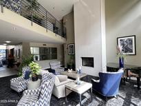 Grand lobby featuring a fireplace, comfortable seating, and a modern, open design at 1701 E Colter St # 4, Phoenix, AZ 85016