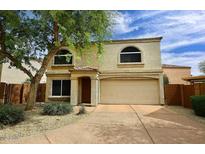 Charming two-story home with a two-car garage and desert landscaping at 17606 N 17Th Pl # 1115, Phoenix, AZ 85022