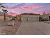 Charming single-story home featuring a low-maintenance desert landscape and a spacious two-car garage at 735 W Ivanhoe St, Gilbert, AZ 85233