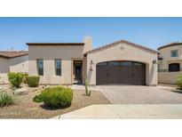 Inviting single-story home featuring a desert landscaped front yard and attached two-car garage at 156 E Leverenz Ave, Queen Creek, AZ 85140