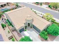 Inviting single-Gathering home with a private pool, lush landscaping, and a three-car garage at 17985 W Jojoba Rd, Goodyear, AZ 85338