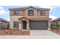 Inviting two-story home featuring a neutral stucco facade, tile roof, and a two-car garage in a modern design at 25147 W Atlanta Ave, Buckeye, AZ 85326