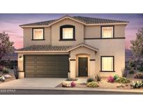 Charming two-story home with a two car garage and desert landscaping at 25147 W Atlanta Ave, Buckeye, AZ 85326