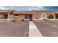 Charming single-story home with a well-manicured, low maintenance front yard and walkway at 317 W Tonopah Dr # 2, Phoenix, AZ 85027
