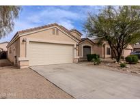 Charming single-story home features a well-kept front yard and attached garage at 34195 N Alison Dr, San Tan Valley, AZ 85144