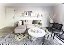 Bright living room with stylish decor and a comfortable sectional couch, perfect for relaxation at 3500 N Hayden Rd # 2103, Scottsdale, AZ 85251