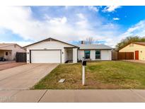 Charming single-story home with a well-maintained front yard and attached two-car garage at 806 W El Alba Way, Chandler, AZ 85225
