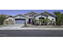 Charming single-story home featuring a two-car garage and professionally landscaped front yard at 1394 E Grand Canyon Dr, Chandler, AZ 85249