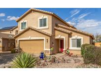 Charming two-story home with a red front door and a well-kept desert-style landscaped front yard at 28071 N Superior Rd, San Tan Valley, AZ 85143