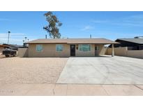 Charming single-story home with a large driveway and low-maintenance landscaping at 3245 N 43Rd N Ave, Phoenix, AZ 85031