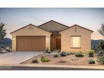 Beautiful desert home with a two-car garage, landscaped yard, and stucco exterior at 5091 S 251St Dr, Buckeye, AZ 85326