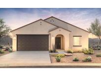 Charming single-story home with a two-car garage and desert landscaping at 5201 S 251St Dr, Buckeye, AZ 85326