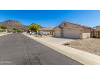 Inviting single story home with two-car garage and low maintenance desert landscaping at 6539 W Briles Rd, Phoenix, AZ 85083