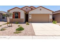 Charming single-story home with a two-car garage, low-maintenance landscaping, and a welcoming front entrance at 7417 E Hackamore Ln, San Tan Valley, AZ 85143