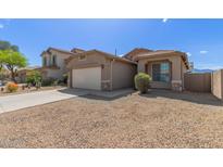 Charming single-Gathering home with a two-car garage and desert landscaping for easy maintenance at 10245 W Parkway Dr, Tolleson, AZ 85353