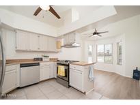 Bright kitchen featuring stainless steel appliances and light wood countertops at 1200 W Boxelder Cir, Chandler, AZ 85224