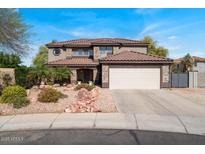 Beautiful two-story home with desert landscaping and a spacious two-car garage at 15834 W Port Au Prince Ln, Surprise, AZ 85379