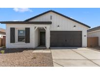 Charming single-story home featuring a two-car garage and stylish modern farmhouse design at 16575 N Lunar St, Maricopa, AZ 85138