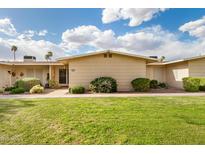 Inviting single-story home with manicured lawn and desert landscaping under a beautiful blue sky at 17627 N 104Th Ave, Sun City, AZ 85373