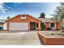 Charming single-story home with an attached two-car garage and a well-manicured front yard at 19645 N 3Rd Ave, Phoenix, AZ 85027
