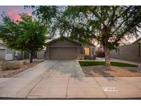 Charming single-story home with a well-manicured lawn and a two-car garage at 3922 N 125Th Dr, Avondale, AZ 85392