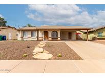 Charming single-story home featuring desert landscaping and covered parking in a suburban neighborhood at 508 W Pampa Ave, Mesa, AZ 85210