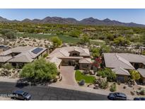 Stunning desert home with lush landscaping, mountain views, and a paver driveway at 21397 N 78Th St, Scottsdale, AZ 85255