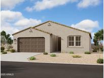 Charming single-story home with a two-car garage and desert landscaping in the front yard at 2370 E Spur Dr, San Tan Valley, AZ 85140