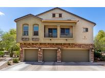 Inviting three-story townhome with a three-car garage and charming balcony, perfect for modern living at 343 N 169Th Ave, Goodyear, AZ 85338