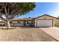 Charming single-story home with a well-maintained front yard and an attached two car garage at 3733 W Flynn Ln, Phoenix, AZ 85019