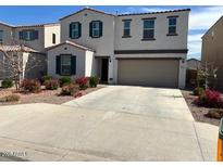 Charming two-story home with a neutral palette and well-maintained landscaping at 7227 N 125Th Dr, Glendale, AZ 85307