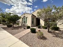 Charming home featuring desert landscaping, a brick walkway, and a well-manicured yard at 10350 E Texas Ave, Mesa, AZ 85212