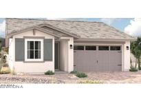 Charming single-story home featuring a neutral color palette, two-car garage, and desert landscaping at 16992 W Winston Dr, Goodyear, AZ 85338