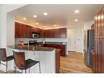 Kitchen includes stainless steel appliances, granite countertops, and dark wood cabinetry at 19700 N 76Th St # 2169, Scottsdale, AZ 85255