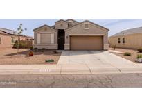 Charming single-story home featuring a well-maintained yard and a two-car garage at 2220 N St Bonita Ln, Casa Grande, AZ 85122