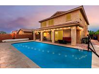 Enjoy a backyard with an inviting private pool, covered patio and no rear neighbors at 2425 E Flintlock Dr, Gilbert, AZ 85298