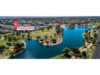 Beautiful aerial view of the property near a lake and lush green park at 8113 E Vista Dr, Scottsdale, AZ 85250