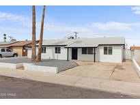 Charming single-story home featuring a minimalist front yard, a well-manicured lawn, and a welcoming entrance at 8132 W Earll Dr, Phoenix, AZ 85033