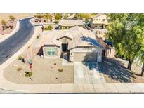 Charming home featuring a two-car garage, neutral tones, and low maintenance desert landscaping in a quiet neighborhood at 1316 E Spencer St, Casa Grande, AZ 85122