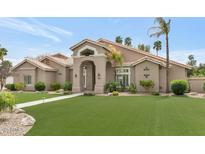 Charming single-story home with well-manicured lawn and desert landscaping at 1405 W Caribbean Ln, Phoenix, AZ 85023