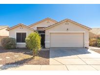Charming single-story home with a well-maintained lawn, desert landscaping and a two-car garage at 2031 S 86Th Ln, Tolleson, AZ 85353