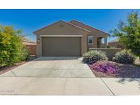Charming single-story home with a two-car garage, desert landscaping, and a welcoming facade at 3597 E Appaloosa Dr, San Tan Valley, AZ 85140