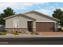 Beautiful single-story home featuring stone accents, desert landscaping, a two-car garage, and a covered front entry at 4315 W Hannah St, San Tan Valley, AZ 85144