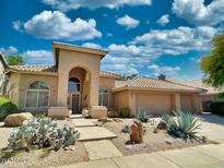 Charming single-story home featuring a three-car garage and desert landscaping at 4867 E Windstone Trl, Cave Creek, AZ 85331