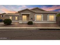 Charming single-story home featuring a neutral stucco exterior, tiled roof, and tidy landscaping at 6228 S Nash Way, Chandler, AZ 85249