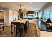 Bright kitchen boasts a center island, stainless appliances, and ample cabinet storage at 4611 E Monterosa St, Phoenix, AZ 85018