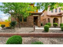 Charming two-story home featuring a stone facade and low maintenance desert landscaping at 5436 W Chisum Trl, Phoenix, AZ 85083