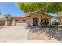 Charming single-story home with desert landscaping, covered entry, and a two-car garage at 1072 E Jade Dr, Chandler, AZ 85286